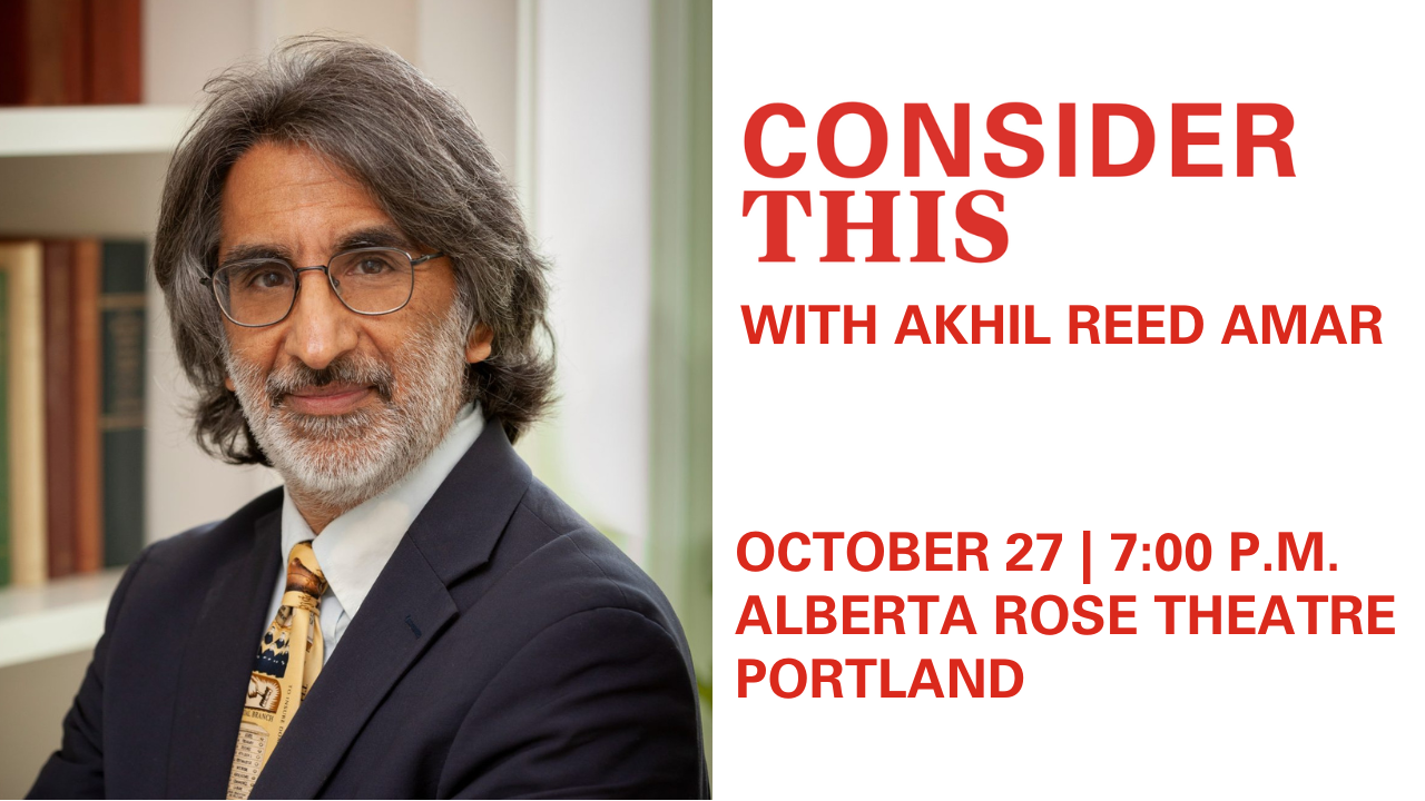 A photo of Akhil Reed Amar, looking at the camera.