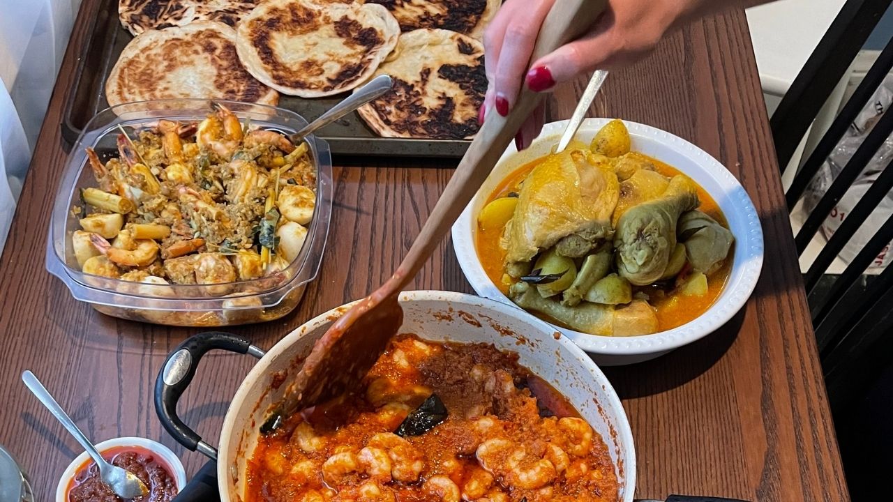 A table full of Malaysian dishes