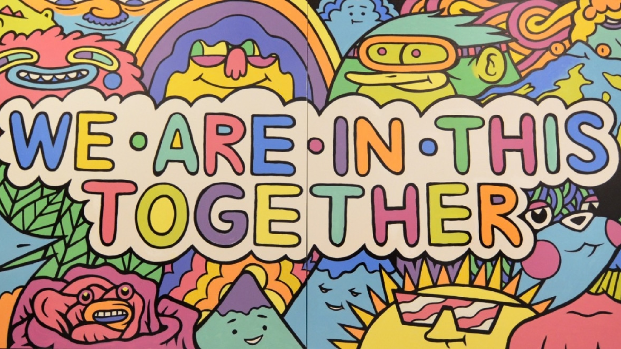 Colorful mural that reads We are all in this together